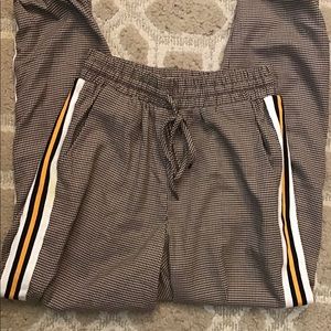 Checkered jogger pants with stripes.